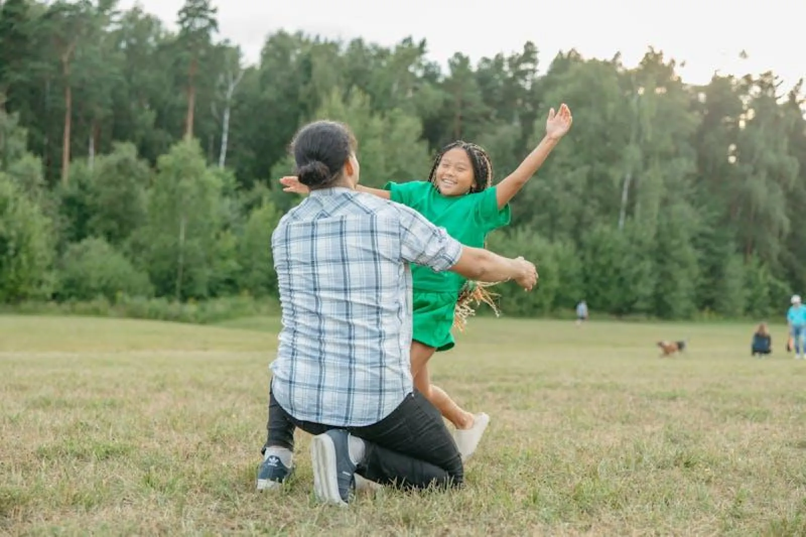 girl running towards a man for a hug